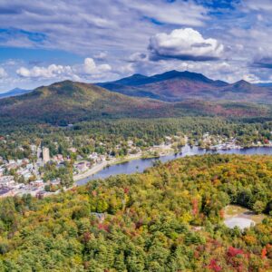An aerial landscape view of a town with mountains